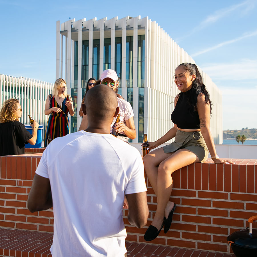 Group of diverse people having a respectful conversation at a social event