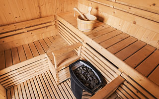What is the proper attire for a public sauna?