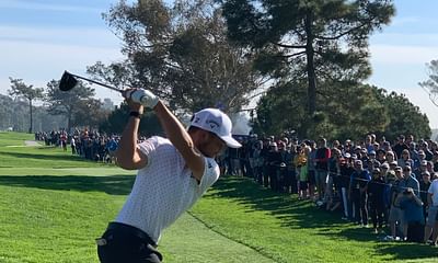 Why do professional golfers take their hats off at the end of a round of golf?